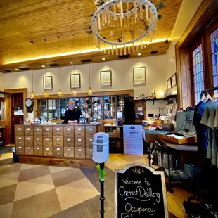 the inside of a restaurant with a checkered floor