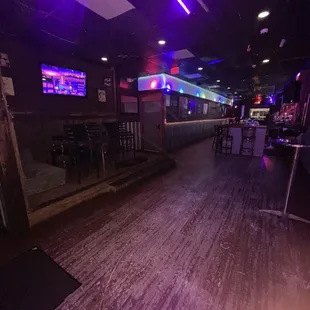 a bar with purple lighting
