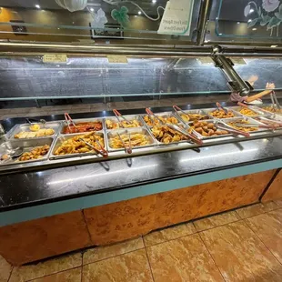 a buffet with a variety of food items