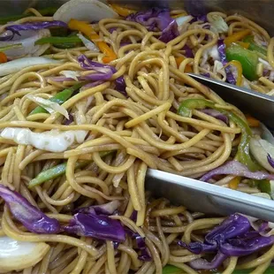 a bowl of noodles and vegetables