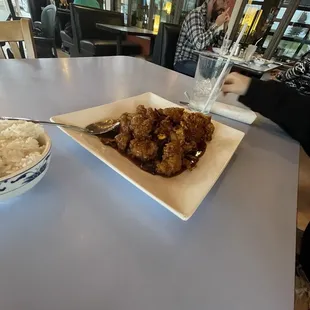 Wide angle orange chicken on enclosed and heated outdoor patio.
