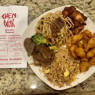 a plate of chinese food and a menu