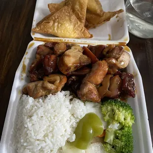 a plate of rice, broccoli, and chicken