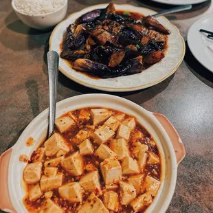 a bowl of tofu and a plate of rice