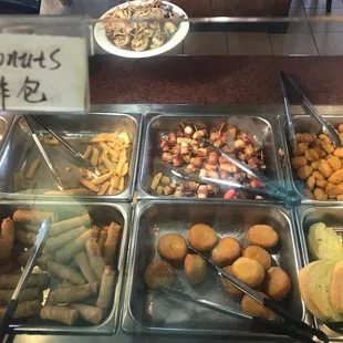 You can find the donuts next to the egg rolls... so good! Hot and sugary!!!!