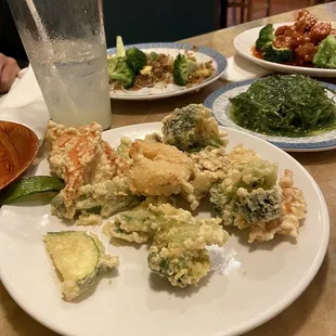 a plate of food and a glass of water