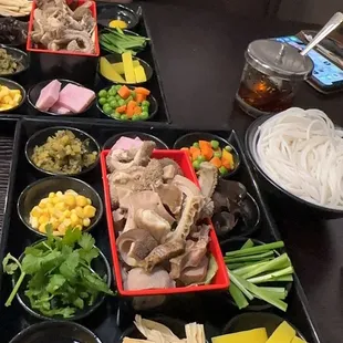 a man sitting at a table full of food