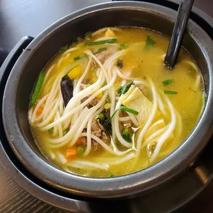 Adding the ingredients to the pickled pepper broth