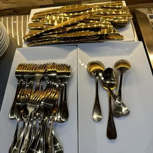 a variety of silverware on display