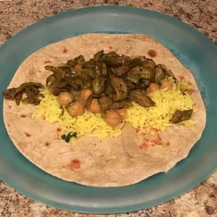 Made some chapati tacos with lemon rice, channa masala and tindora fry. A vegan flavor explosion!
