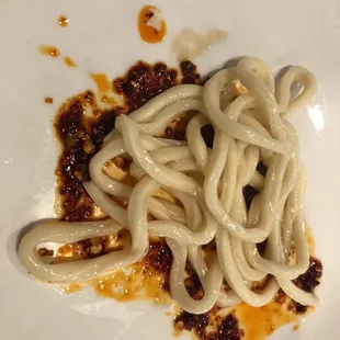 a plate of noodles and sauce