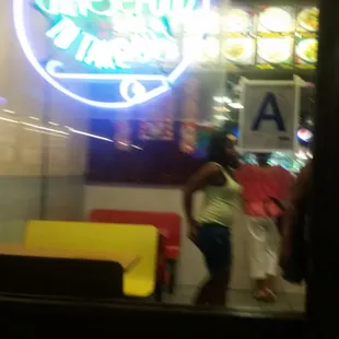 a neon sign in the window