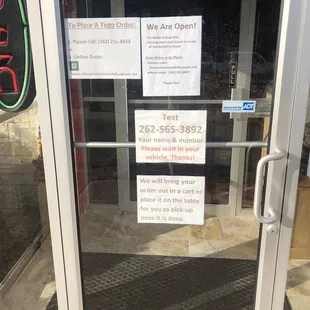 a closed door with a sign on it