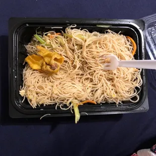 a tray of noodles and vegetables