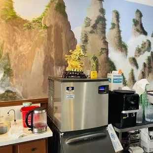 a kitchen with a mountain mural