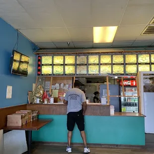 a man standing at the counter