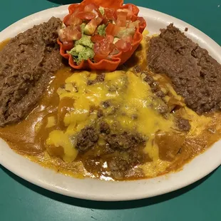 Beef enchiladas with double beans no rice. Nice little avocado salad.