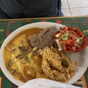 Beef enchiladas, refried beans, Mexican rice, and a cute set up of guacamole salad in a crunchy tortilla bowl!