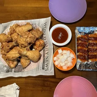 Fried chicken with hot &amp; spicy sauce on the side. Appetizer so-ddeok so-ddeok.