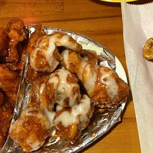 Half spicy half Supreme Chicken. Squid ring on the side