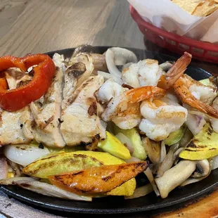 Chicken and shrimp fajitas. I like this combo because you get squash, zucchini, mushrooms &amp; onions