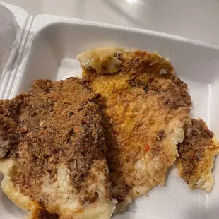 a meal in a styrofoam container