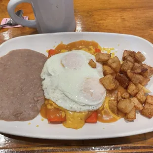 Cheese enchiladas with eggs over easy