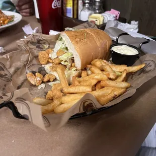 Half a shrimp PoBoy (other half was in my daughter's mouth as she took bite.  Tartare Sauce is house made.