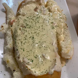 Seafood Bateau Appetizer...Boat Shaped bread w/ seafood sauce (crab meat, shrimp, crawfish &amp; crab claws.) Amazing!