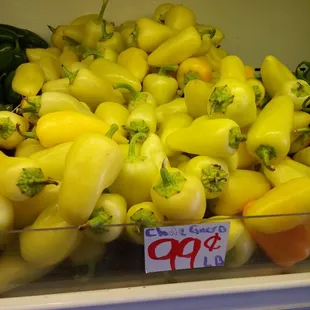 a display of yellow peppers