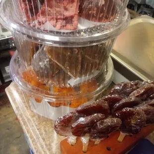 a variety of meats on a cutting board