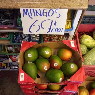 a variety of mangos in baskets