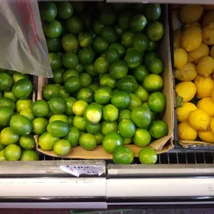 lemons and limes in boxes