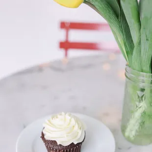 Black Tie Cupcake. Our signature cupcake. Chocolate cupcake with a cheesecake and chocolate chip swirl center.