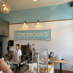 a woman working behind the counter