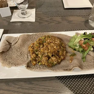 Fish dullet with gluten-free injera