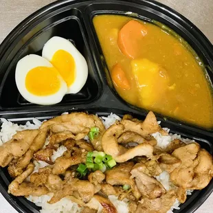 a meal of rice, meat, and eggs