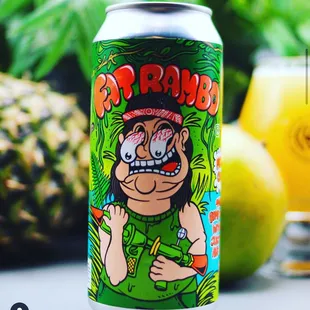 a can of pineapple beer with a pineapple in the background