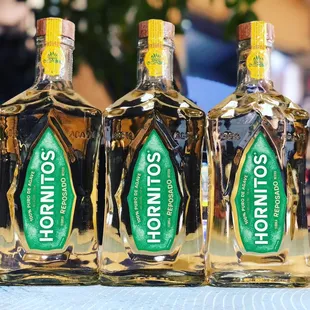 three bottles of horritos on a table