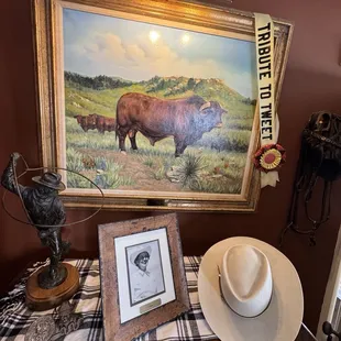 A painting of the stud bull for Cherokee Ranch. Photo of Tweet beneath it.