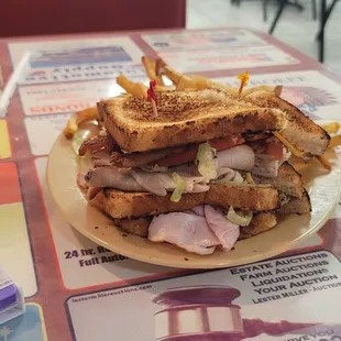 They use a little thinner bread so they don't cut it in 4ths it's triple stacked but only halved. Triple stack club french fries