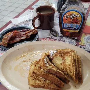 French toast dusting of powdered sugar sugar-free syrup coffee nice thick sliced bacon.