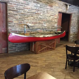 Salad bar in a canoe.