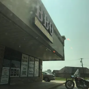 a motorcycle parked in front of a bbq