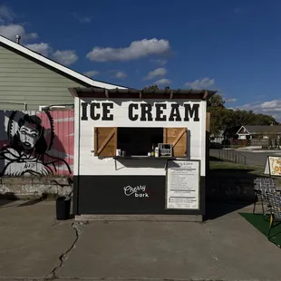 an ice cream stand in a residential area