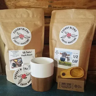 Ah, Nuts dark roast coffee, 1/2 Calf coffee blend, porcelain wood coffee mug, and a De Palo coffee wood short scoop