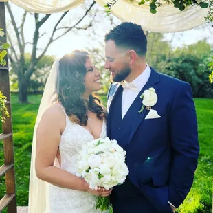 Beautiful bouquet and arch arrangement from Cherry Blossom Bouquet