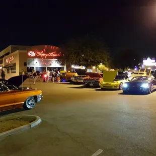 cars parked in a parking lot at night