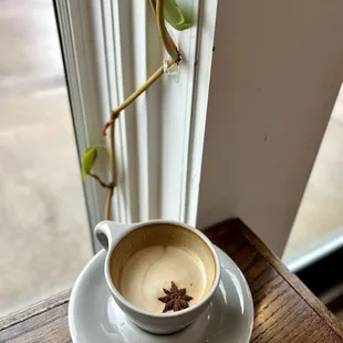 a cup of coffee on a saucer