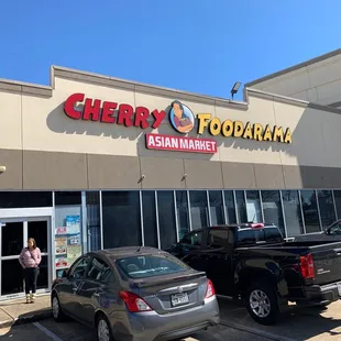 a woman standing in front of the store